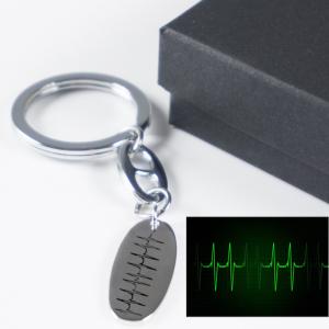 Llavero de plata ovalado personalizado 'Latidos'