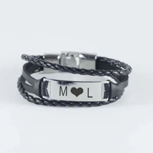 Pulsera grabada de acero y piel