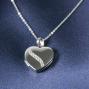Regalos personalizados: Joyas personalizadas: Colgante coraz&oacute;n de plata grabado para 2 fotos